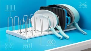 YouCopia expandable cookware rack holding pots, pans, and lids inside a kitchen cabinet